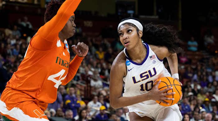 LSU’s Angel Reese goes up to shoot over Miami’s Kyla Oldacre in the the Elite Eight of the NCAA women’s tournament.